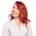 A woman wearing a white shirt with red hairs